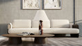 Table lamp with a burgundy marble base and a corrugated shade on a coffee table
